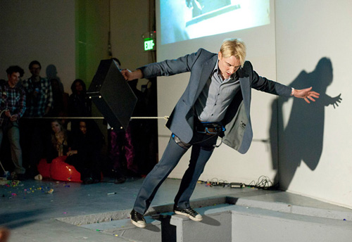 Scotch Wichmann, performance artist, performing at SOMArts 100 Performances For The Hole in San Francisco, January, 2014
