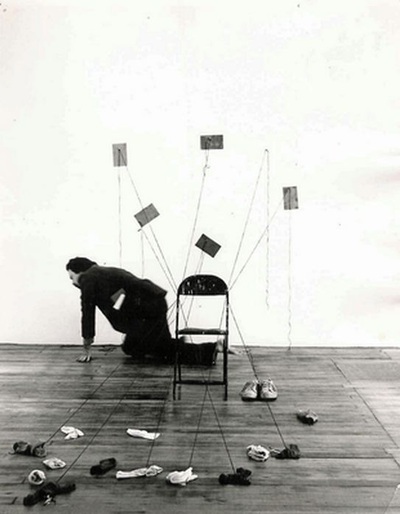 John M. White doing performance art with word-play, string, and socks
