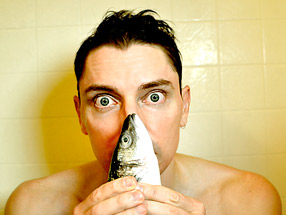 Scotch Wichmann sniffing a branzino in the shower
